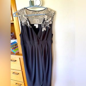 Never worn dress from Anthropologie. Lace detail at shoulder tulip hem